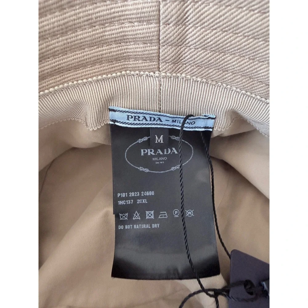 Prada 1HC137 100% cotton bucket hat with embroidered white stitch logo